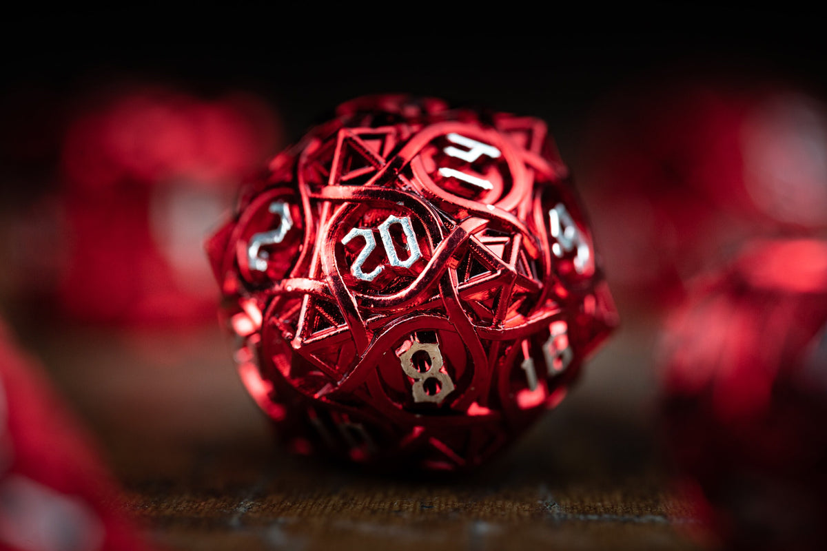 Blood Hunter Metal Dice Set – close-up of red metallic d20 die with engraved numbers